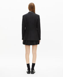 The Kooples FEMME BLACK veste à rayures tennis en laine mélangée noire