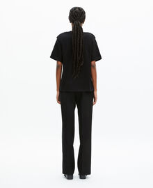 The Kooples FEMME BLACK WASHED t-shirt avec chaînes noir